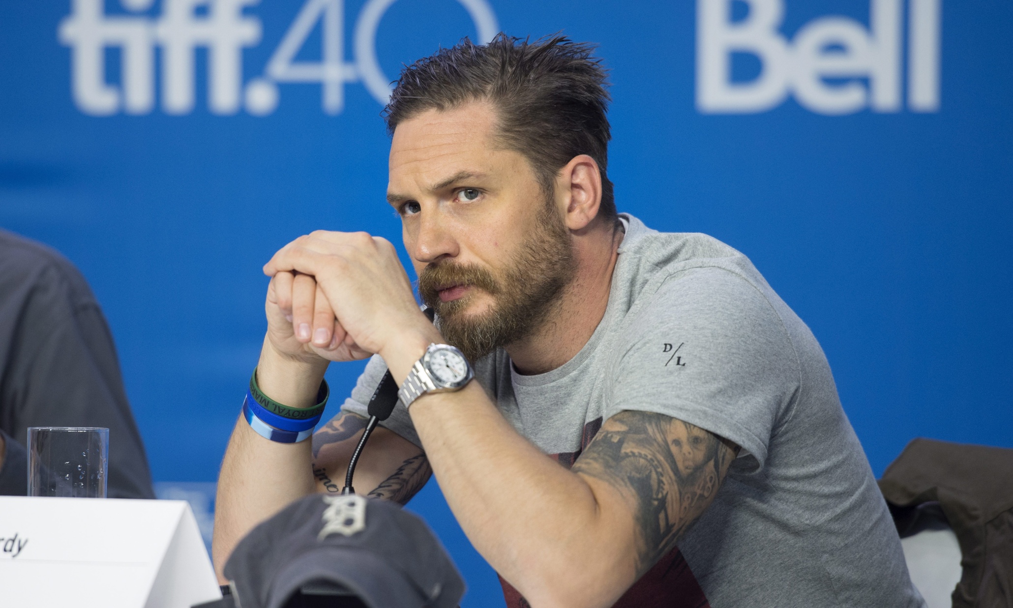 Actor Tom Hardy listens during a press conference promoting the film "Legend" during the 2015 Toronto International Film Festival in Toronto on Sunday, Sept. 13, 2015. (Darren Calabrese/The Canadian Press via AP)