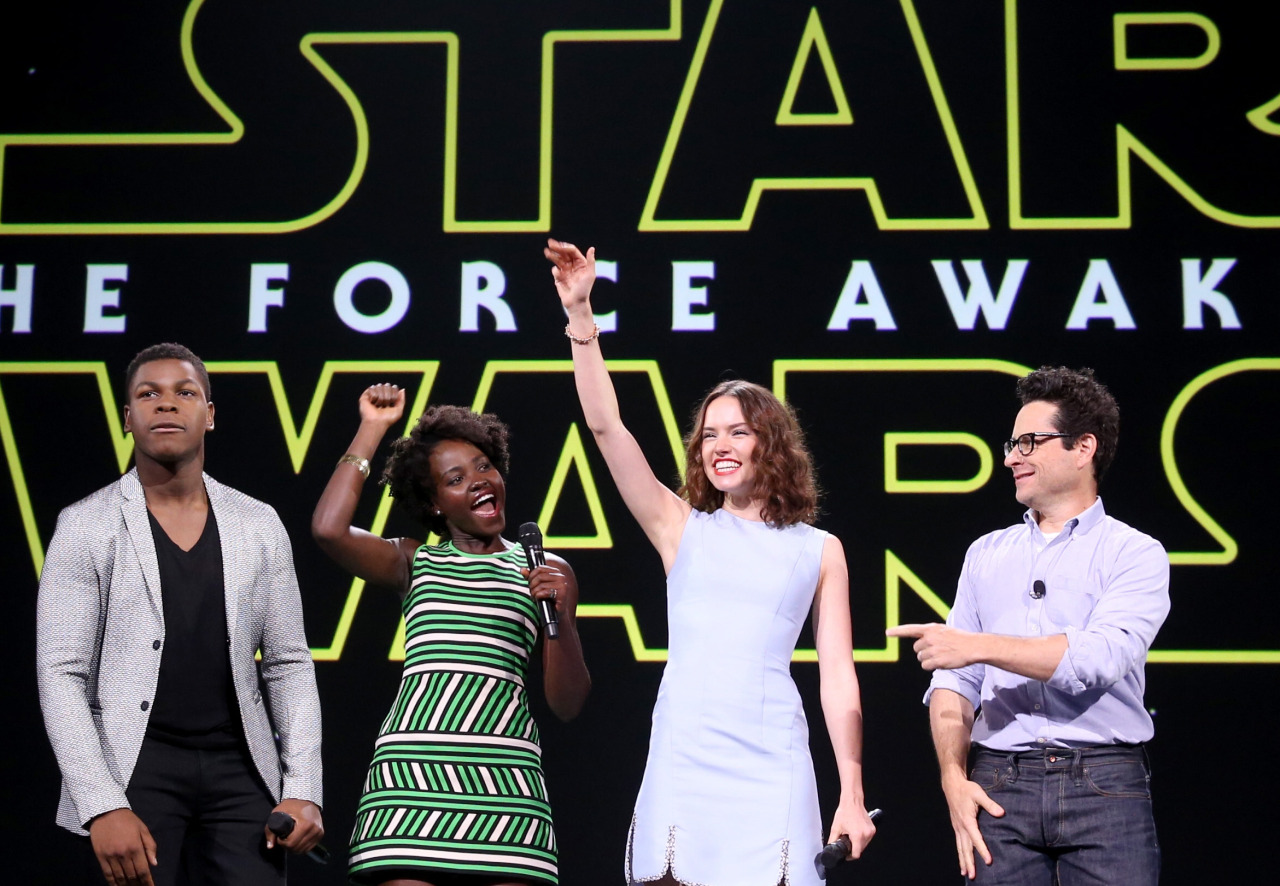 ANAHEIM, CA - AUGUST 15: (L-R) Actors Oscar Isaac, John Boyega, Lupita Nyong'o, Daisy Ridley, director J.J. Abrams of STAR WARS: THE FORCE AWAKENS and Chairman of the Walt Disney Studios Alan Horn took part today in "Worlds, Galaxies, and Universes: Live Action at The Walt Disney Studios" presentation at Disney's D23 EXPO 2015 in Anaheim, Calif. (Photo by Jesse Grant/Getty Images for Disney)