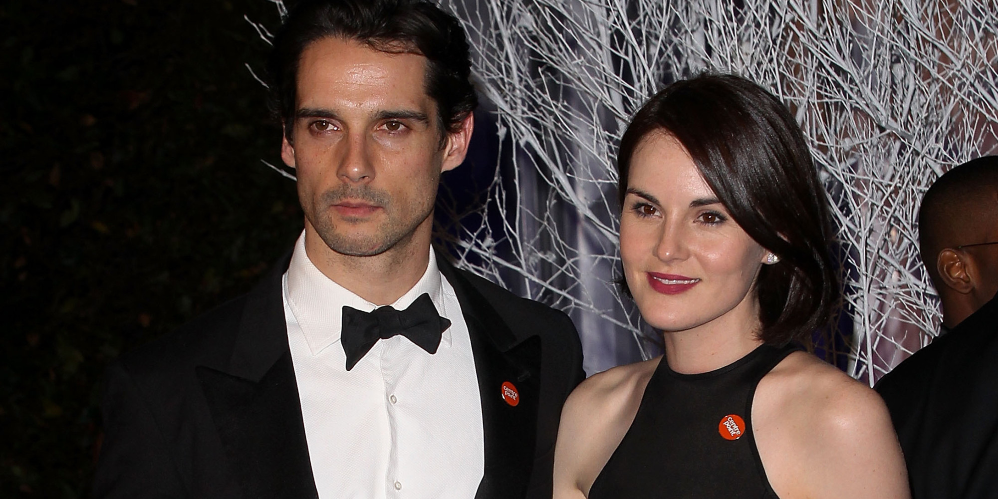 LONDON, ENGLAND - NOVEMBER 26: Michelle Dockery (R) and boyfriend John Dineen attend the Winter Whites Gala in aid of Centrepoint at Kensington Palace on November 26, 2013 in London, England. (Photo by Danny Martindale/WireImage)