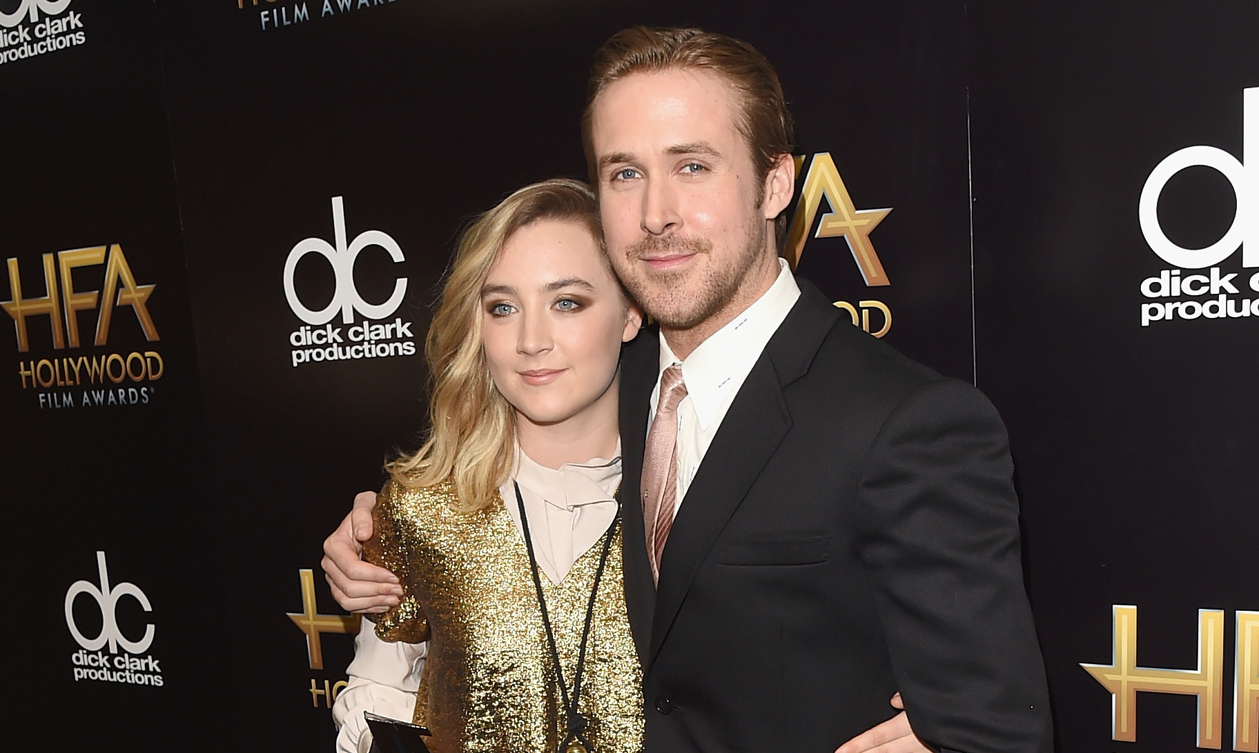 BEVERLY HILLS, CA - NOVEMBER 01: Actors Saoirse Ronan (L), winner of the New Hollywood Award for 'Brooklyn', and Ryan Gosling pose in the press room during the 19th Annual Hollywood Film Awards at The Beverly Hilton Hotel on November 1, 2015 in Beverly Hills, California. (Photo by Jason Merritt/Getty Images)